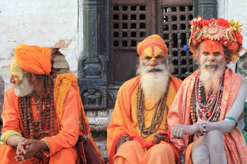 Research Tour in Nepal: Discovering the Beauty of Nepal 7 three men wearing orange tradition clothes