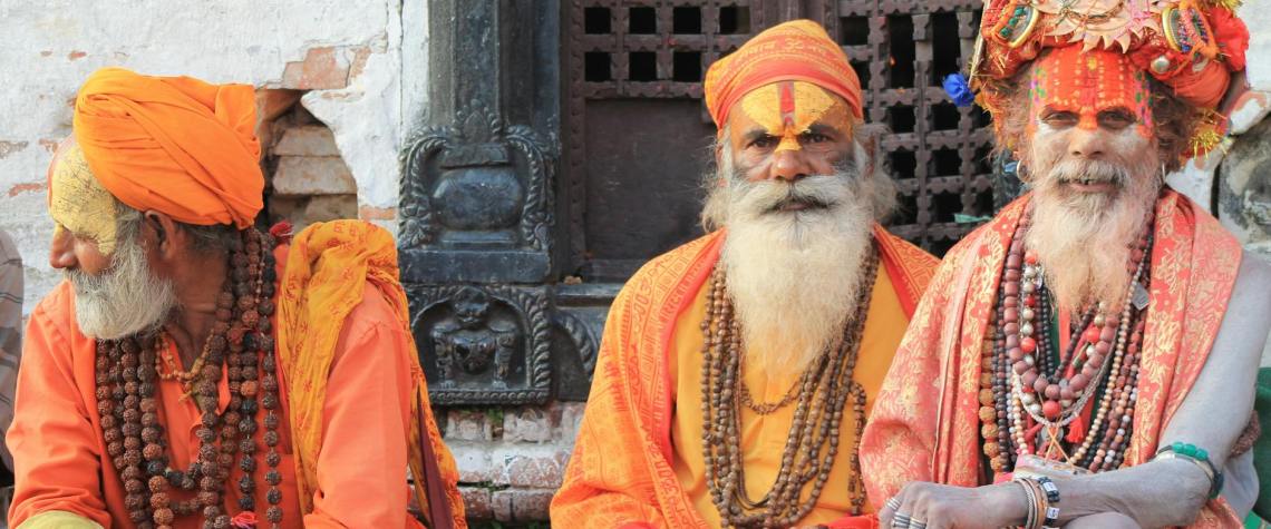 Spiritual Side of Nepal: Exploring Sacred Sites 1 Spiritual Side of Nepal: three men wearing orange tradition clothes