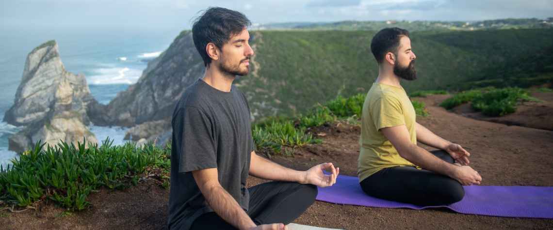 Benefits of Yoga for Trekkers and Hikers 1 two men doing yoga