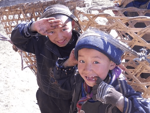 8 Amazing Things about Nepal 3 Sherpa children carrying Doko, a traditional basket